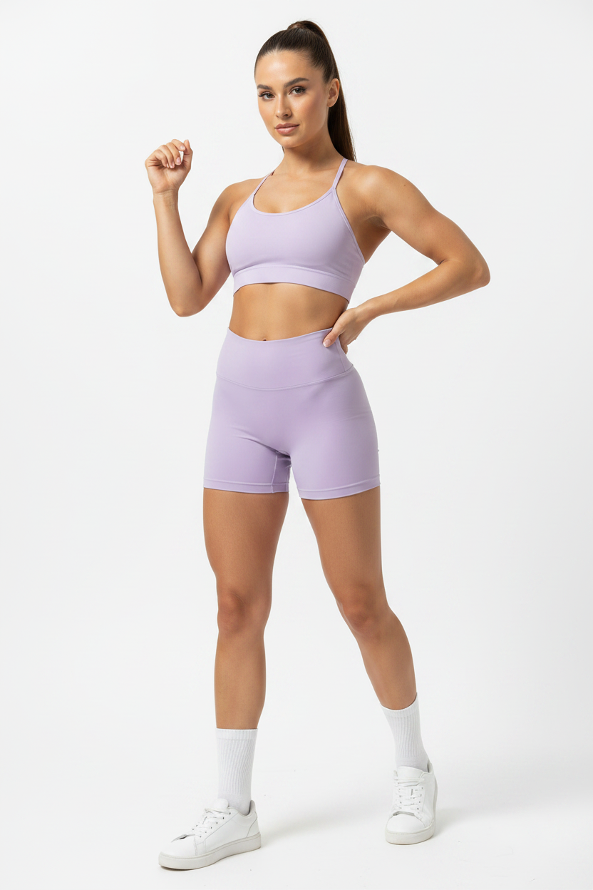 Model wearing light purple high-waist sports shorts